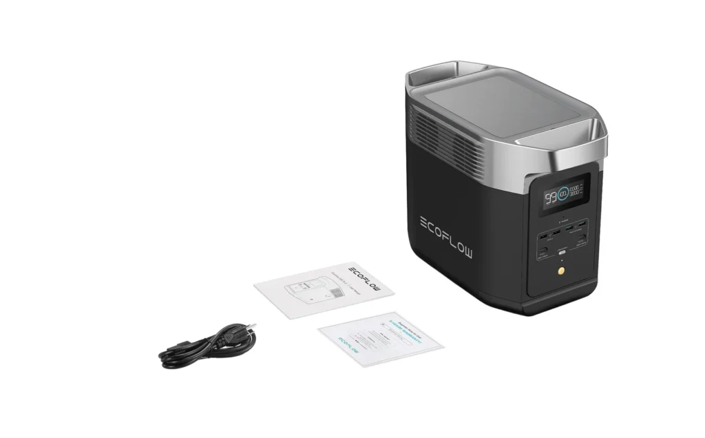Vista completa del unboxing de la EcoFlow Delta 2 con cables de carga, manuales y unidad principal.